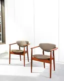 A Pair of 109 Chairs by Finn Juhl for Niels Vodder, circa 1946, teak and fabric upholstery, sold Apr 2016