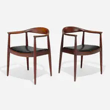 The Chairs, pair by Hans J. Wegner, 1949, oak, fabric, sold May 2024