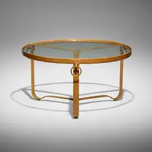 Jacques Adnet, Coffee table, c. 1955, saddle-stitched leather over steel, brass, glass