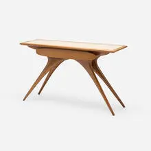 Console by Vladimir Kagan, c. 1955, walnut, glass, sold Apr 2024