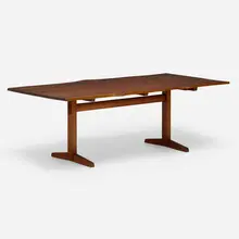Trestle dining table by George Nakashima, 1960, American black walnut, rosewood, sold Mar 2024