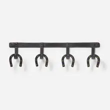 Jacques Adnet, Coat rack, c. 1955, saddle-stitched leather over steel