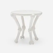 Bone occasional table by John Dickinson, 1977, painted carved wood, sold Mar 2024