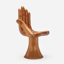 Hand chair by Pedro Friedeberg, c. 1965, stacked laminated mahogany, sold Mar 2024