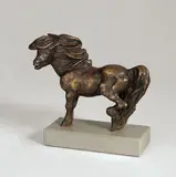 Auskeilendes Pony by Renée Sintenis, 1941, Bronze mit brauner Patina, auf Steinsockel montiert. Höhe (ohne Sockel): 10,4 cm (4 ⅛ in.), sold Nov 2008