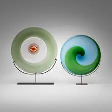 Piatti di Tapio plate, model 511.40 l and Coreani plate, model 511.40 0 by Tapio Wirkkala, 1967 / 1983, glass with polychrome murrina; transparent glass with aquamarine and green twisted bands, sold Feb 2024