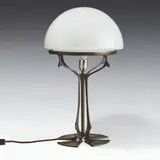 Table lamp by Peter Behrens, bronze patinated, colourless glass, white overlay; electrified, sold Oct 2026