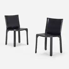 Cab chairs model 412, pair by Mario Bellini, leather, enameled steel, plastic, sold Jan 2024
