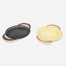 Trays, pair by Mathieu Matégot, c. 1950, perforated and lacquered steel, rattan, sold Jan 2024