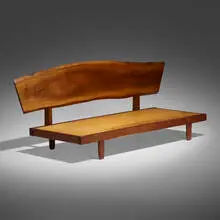Daybed with back by George Nakashima, 1973, American black walnut, upholstery, sold Dec 2023