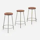 Stools from the College of Architecture, Chandigarh, set of three by Pierre Jeanneret, c. 1960, enameled steel, teak, sold Oct 2023