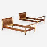 Twin-size bedframes, pair by Finn Juhl, c. 1951, walnut, maple, sold Oct 2023