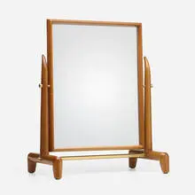 Vanity mirror by T. H. Robsjohn-Gibbings, c. 1955, mahogany, mirrored glass, brass, sold Oct 2023