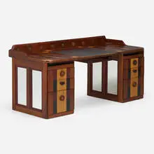 Double pedestal desk by Phillip Lloyd Powell, c. 1995, walnut, ash, slate, ebony, cocobolo, painted wood, patinated metal, bone inlay, mirrored glass, sold Oct 2023