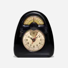 Measured Time clock and kitchen timer by Isamu Noguchi, c. 1932, Bakelite, plastic, printed paper, enameled brass, sold Oct 2023
