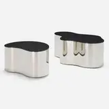Karl Springer, Free form coffee tables, set of two, c. 1970, stainless steel, black glass