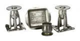 for Liberty & Co: A pair of  pewter dwarf candlesticks by Archibold Knox, Each with bullet shaped sconces raised on four uprights on a folded openwork square foot, stamped 'English Pewter No, offered Jul 2015