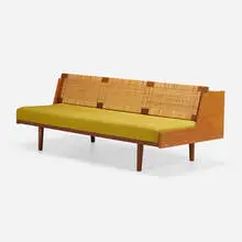Daybed, model GE 6 by Hans J. Wegner, c. 1965, teak, painted wood, upholstery, caning, chrome-plated steel, sold Oct 2023