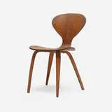 Dining chair by Norman Cherner, c. 1965, walnut plywood, sold Aug 2023