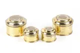 Four italian silver boxes by Giovanni Fino, 1762, cylindrical in shape and of various sizes. The bodies of the boxes have a golden finish, offered Feb 2026