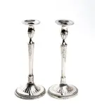 A pair of italian solid silver candelsticks by Antonio Cappelletti, 1815, Circular foot with vertical ribs and beaded rim, offered Feb 2026