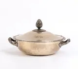 Solid silver Austrian entrée dish by Josef Carl Klinkosch, 1867, circular in shape with a snap-on lid. The lid features a handle representing a rich cluster of leaves and a flower, offered Feb 2026