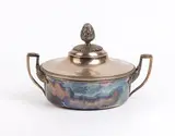 Solid silver French entrée dish by Antoine Cosson, 1854, round in shape with a snap-on lid. The lid is topped with a pine cone-shaped knob and features a radiating leaf, offered Feb 2026