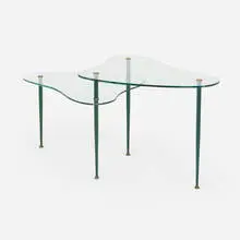 Two-tier coffee table by Modern, c. 1955, tempered glass, enameled steel, brass, sold Aug 2023