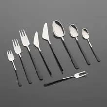Contrast flatware service by Erik Herlow, 1959, stainless steel, sold Aug 2023