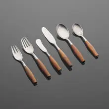 Fjord flatware set by Jens Quistgaard, 1954, stainless steel, teak, sold Aug 2023