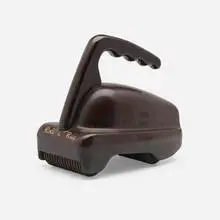 Roll a Ray massager by D.A. Sutton Corp, c. 1940, Bakelite, sold Aug 2023