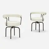 LC7 chairs, pair by Charlotte Perriand, leather, enameled steel, sold Aug 2023