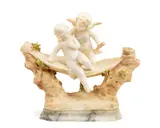 carved alabaster figural group depicting Cupid and a female putto by Alberto Saccardi, alabaster, offered Dec 2015