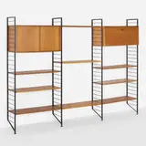 Ladderax wall shelving system by Robert Heal, 1964, teak, enameled steel, brass, sold Aug 2023