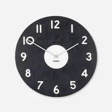 Wall clock, model 2504 by Arthur Umanoff, c. 1960, vinyl, aluminum, lacquered wood, sold Aug 2023