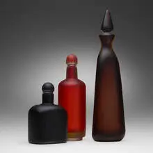 Inciso bottles with stoppers, set of three by Paolo Venini, wheel-carved glass, sold Jul 2023