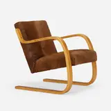 Rare Cantilevered armchair by Alvar Aalto, laminated birch, cowhide, sold Jun 2023