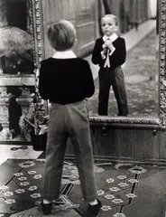 Young English man looking in the mirror of the Grand Hotel in St. Moritz by Alfred Eisenstaedt, 1932, Späterer Silbergelatineabzug, sold Oct 2021