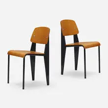 Standard chairs, pair by Jean Prouvé, enameled steel, teak plywood, aluminum, rubber, sold Jun 2023