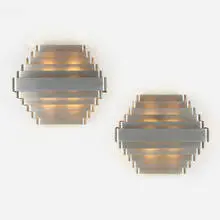 Sconces, pair by Jules Wabbes, c. 1950, brushed chrome-plated bronze, sold Jun 2023