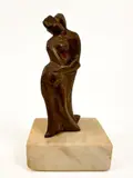Edition 1/50. Signature etched onto the back bottom of the by Irving Marantz, bronze. Sculpture sits on a marble pedestal. Depicts two figures embracing. Dime, sold Jan 2026