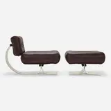 Lounge chair and ottoman by Oscar Niemeyer, 1972, leather, stainless steel, plastic, sold Jun 2023