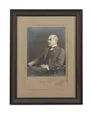 signed photograph in ink. Attached to mounting board. Elliot & Fry studio (English 1863-1962) silver gelatin photograph by Rudyard Kipling, circa 1928, ink signature. Framed, sold Feb 2024