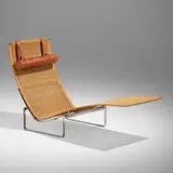 PK 24 chaise lounge by Poul Kjaerholm, 1967, chrome-plated stainless steel, cane, leather, sold Jun 2023