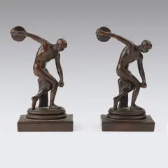 Bookends. Marked "P.C.B. Disc Thrower." by Myron, Bronze, offered Dec 2025