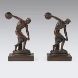 Bookends. Marked "P.C.B. Disc Thrower." by Myron, Bronze, offered Dec 2025
