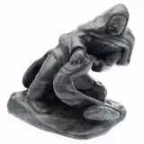 Woman Cleaning Fish, 1982, signed "Levi" and marked "AVF" "IA-05226" on bottom, with Canadian gallery sticker, depicting a kneeling figure with two fish by Levi Qumaluk, carved in dark grey soapstone, sold Feb 2024