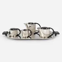 Etchea coffee and tea service by Jean E Puiforcat, 1928, silver plate, lacquered mahogany, sold Jun 2023