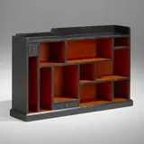 Early bookcase from the artist's cabin, Bearsville, New York by Paul Theodore Frankl, c. 1925, lacquered wood, patinated brass, sold Jun 2023