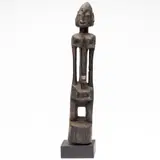 probably Dogon, Mali by African Carved Wood Female Figure, carved wood female figure, sold Oct 2023